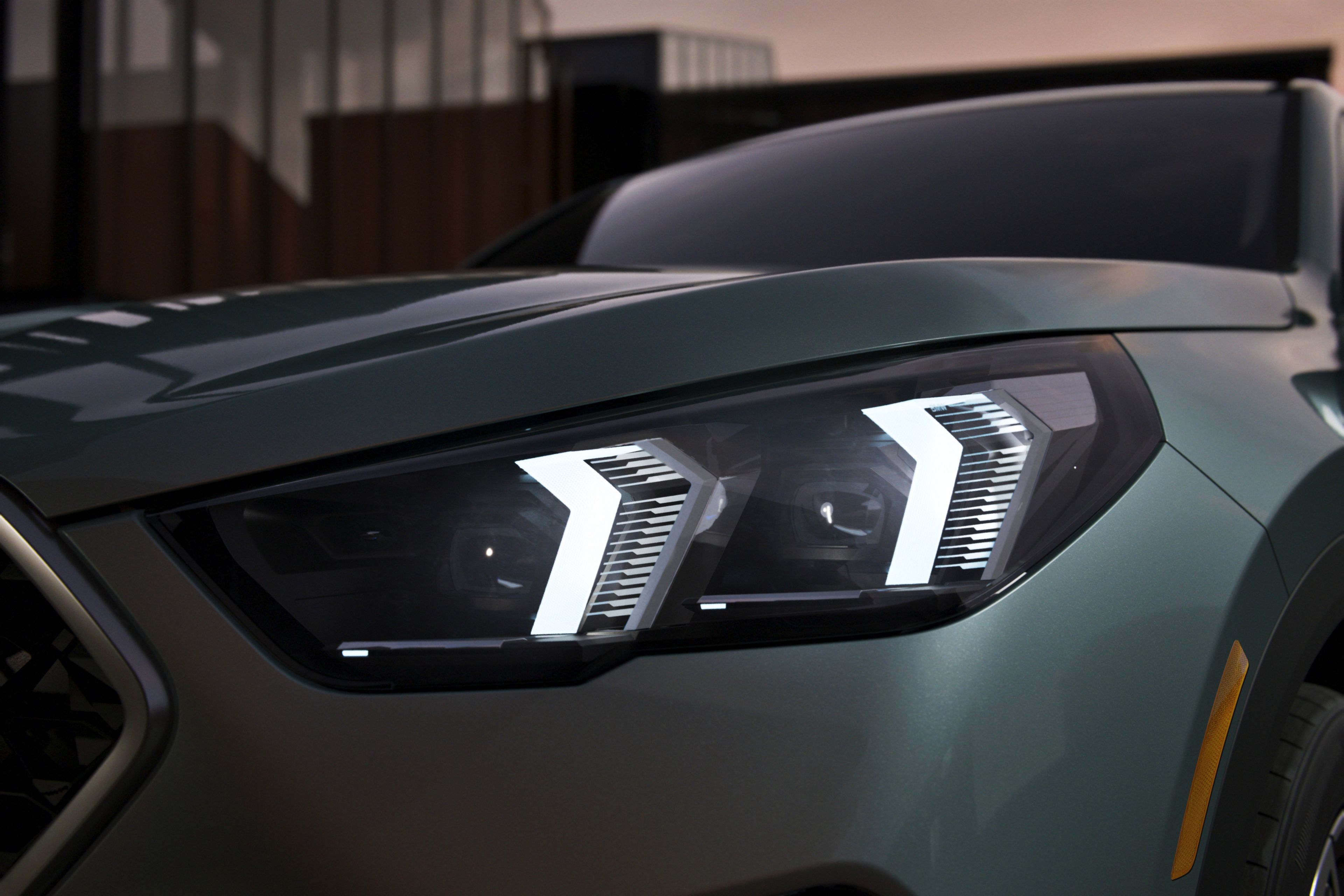 Close up view of the X2 Coupe SUV's LED front headlights